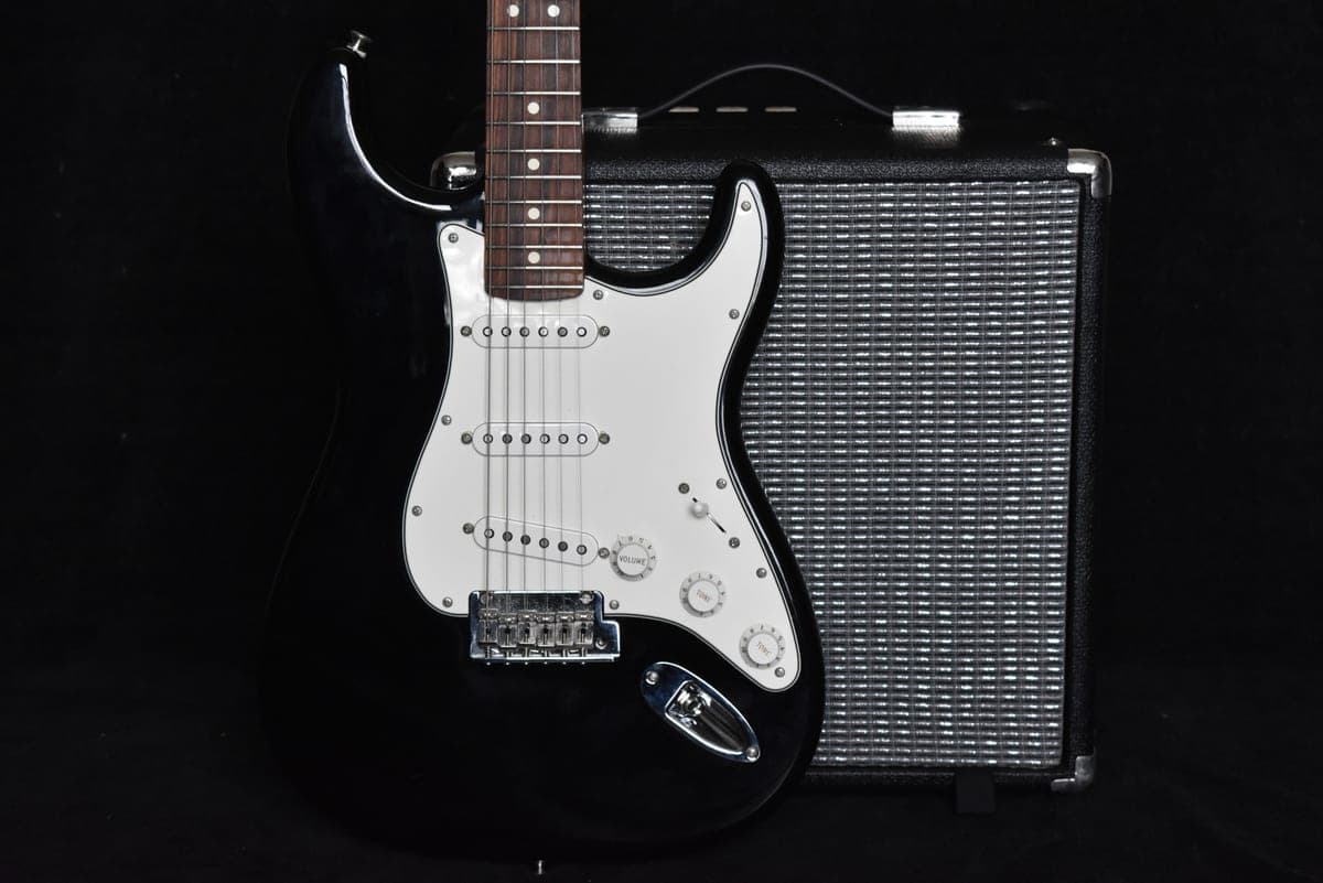 A guitar combo amplifier on a stage floor