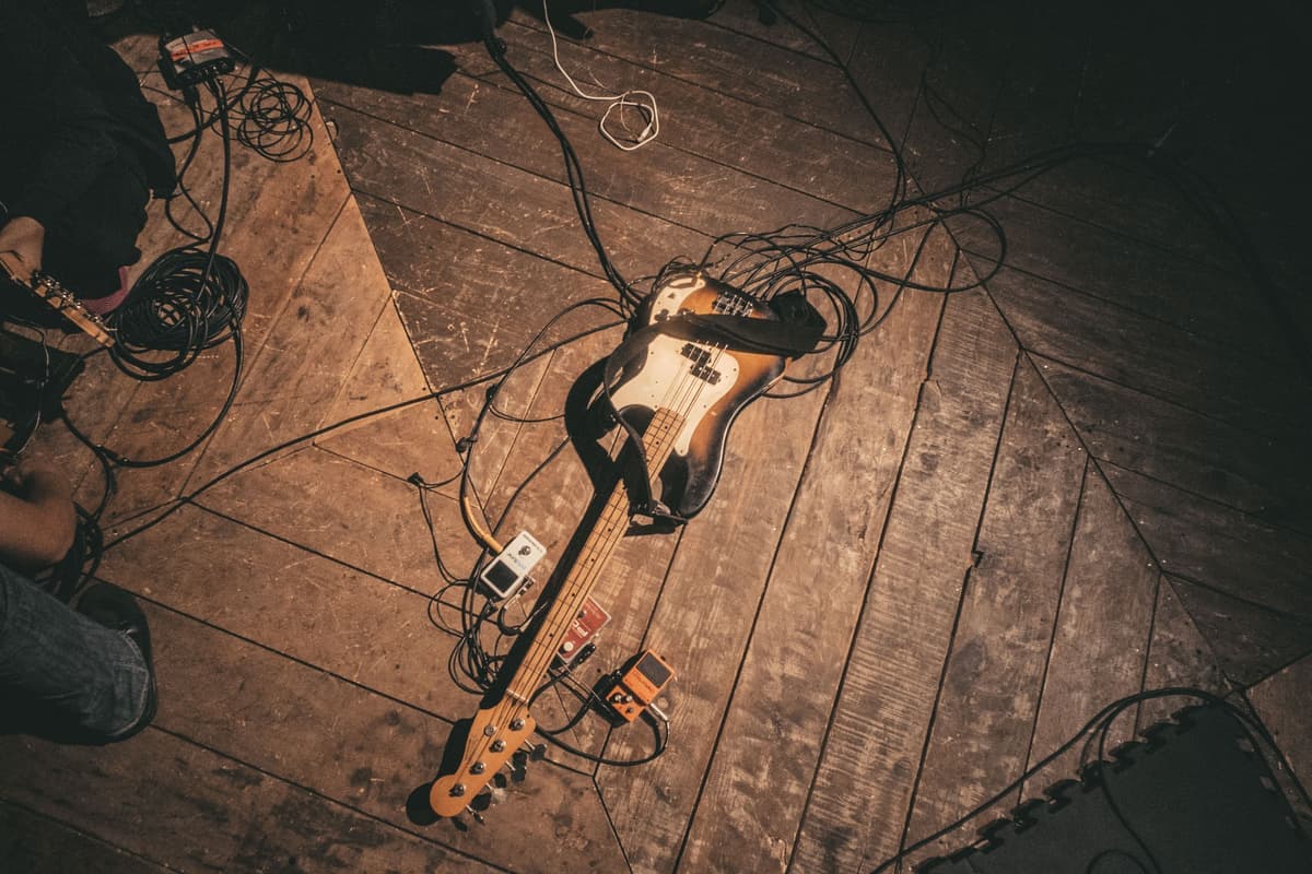 A large fuzz pedal on a scuffed stage floor
