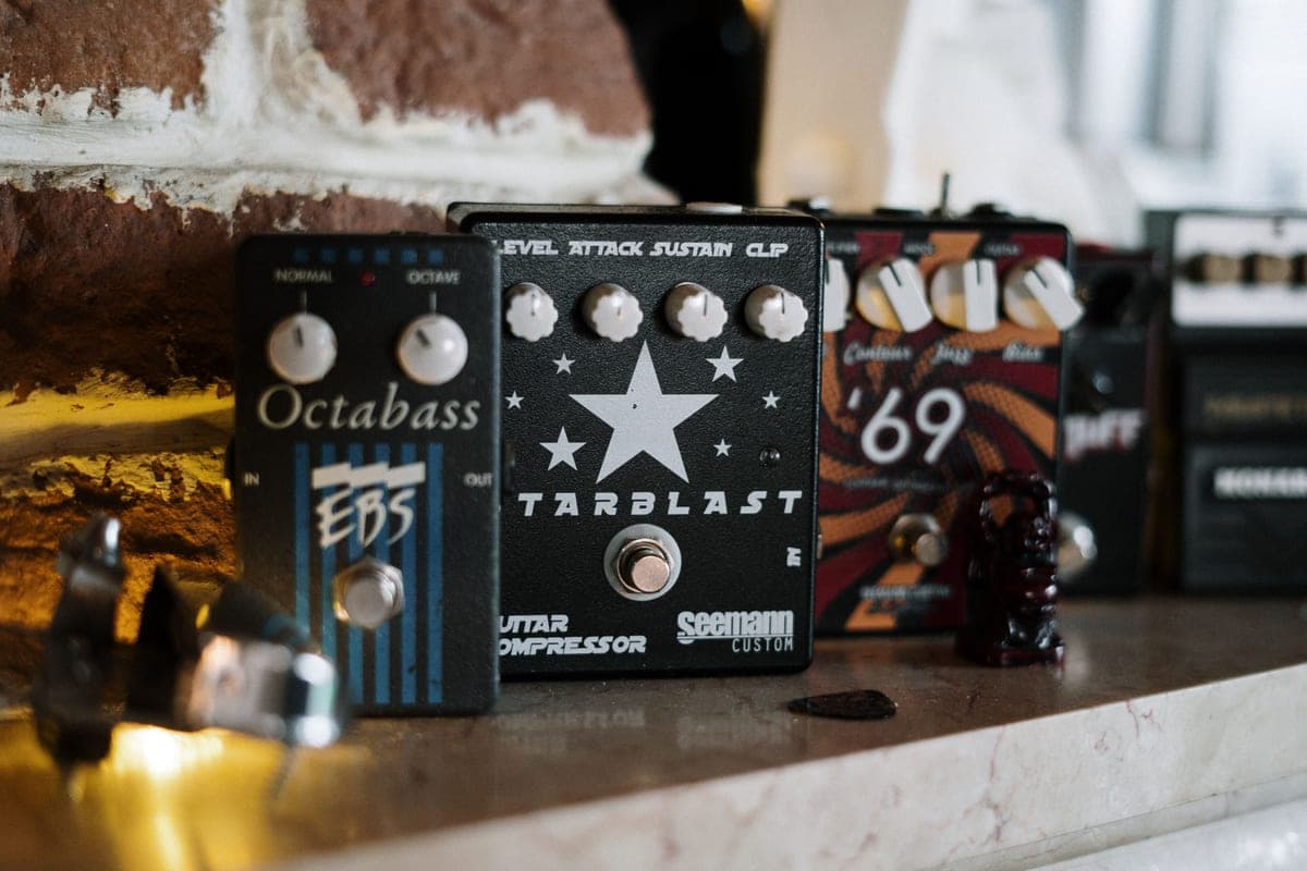 A modulation pedal photographed close on a wooden surface