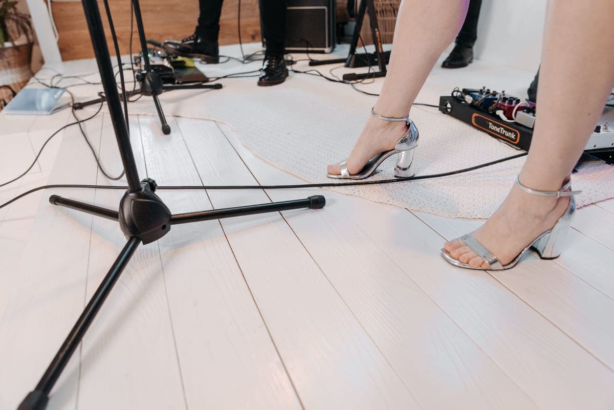 A small pedalboard with a few pedals set up on a floor