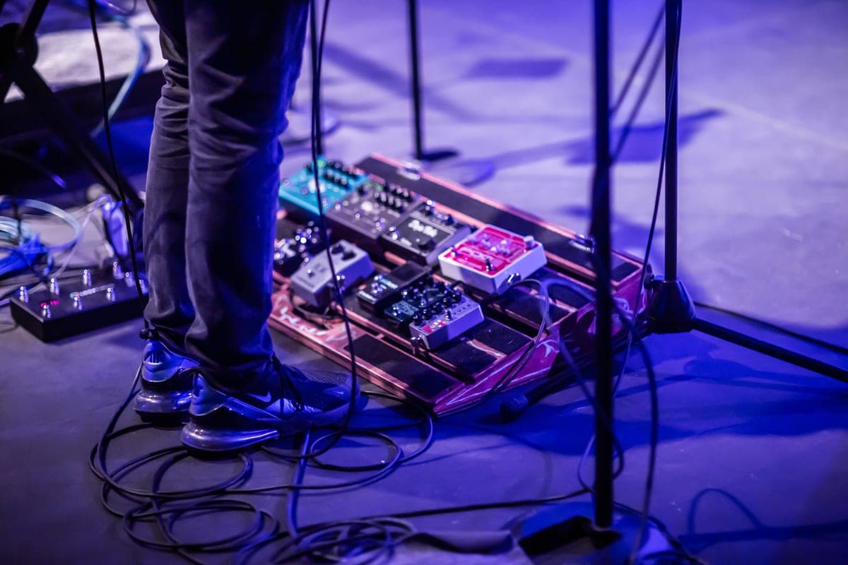 An empty aluminum pedalboard frame on a floor